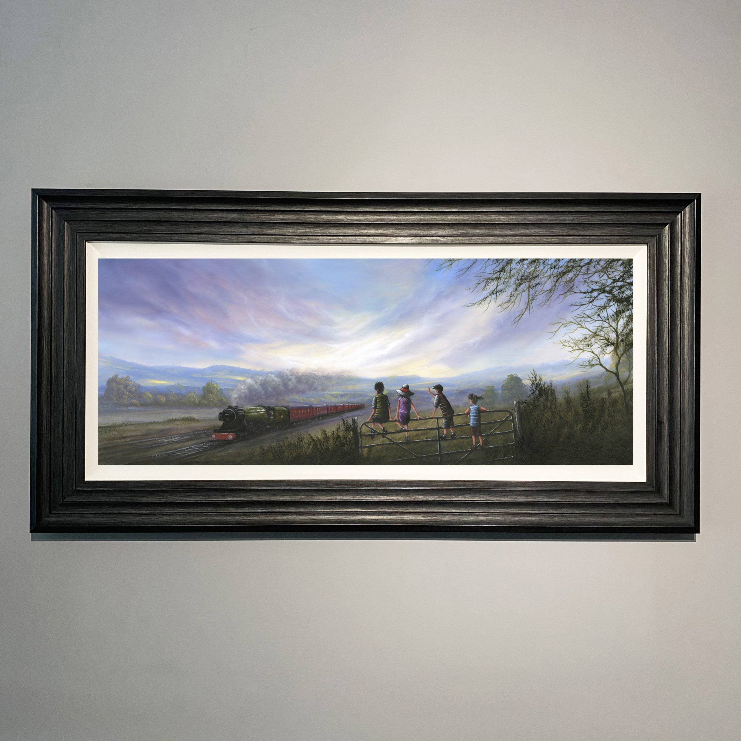 a Steam train passes through the Haworth landscape in Yorkshire as a group of children look on inspired by the railway children