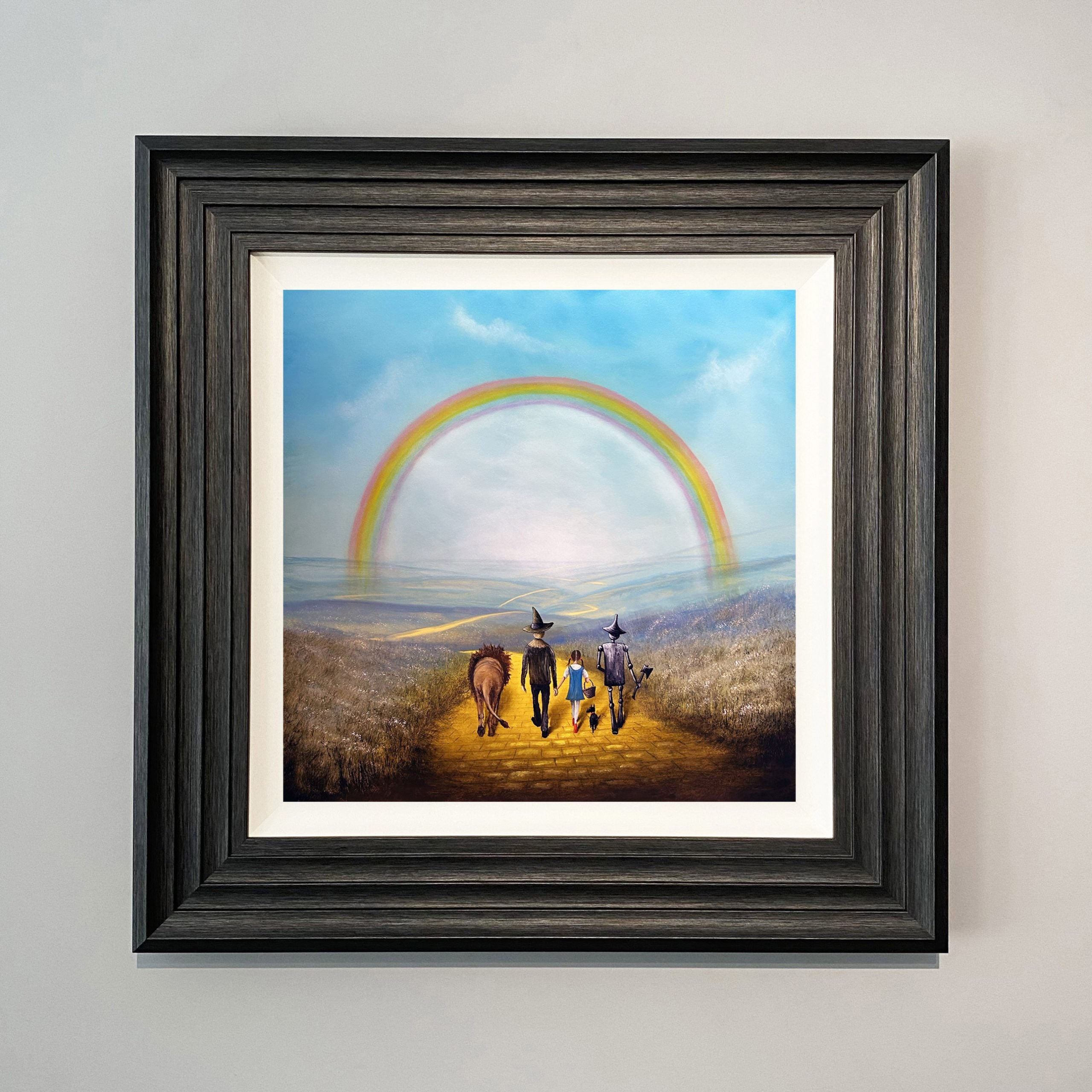 Wizard of Oz inspired painting of Dorothy, Toto, Scarecrow, Tin Man and Lion walking the yellow brick road beneath a rainbow by Danny Abrahams Art