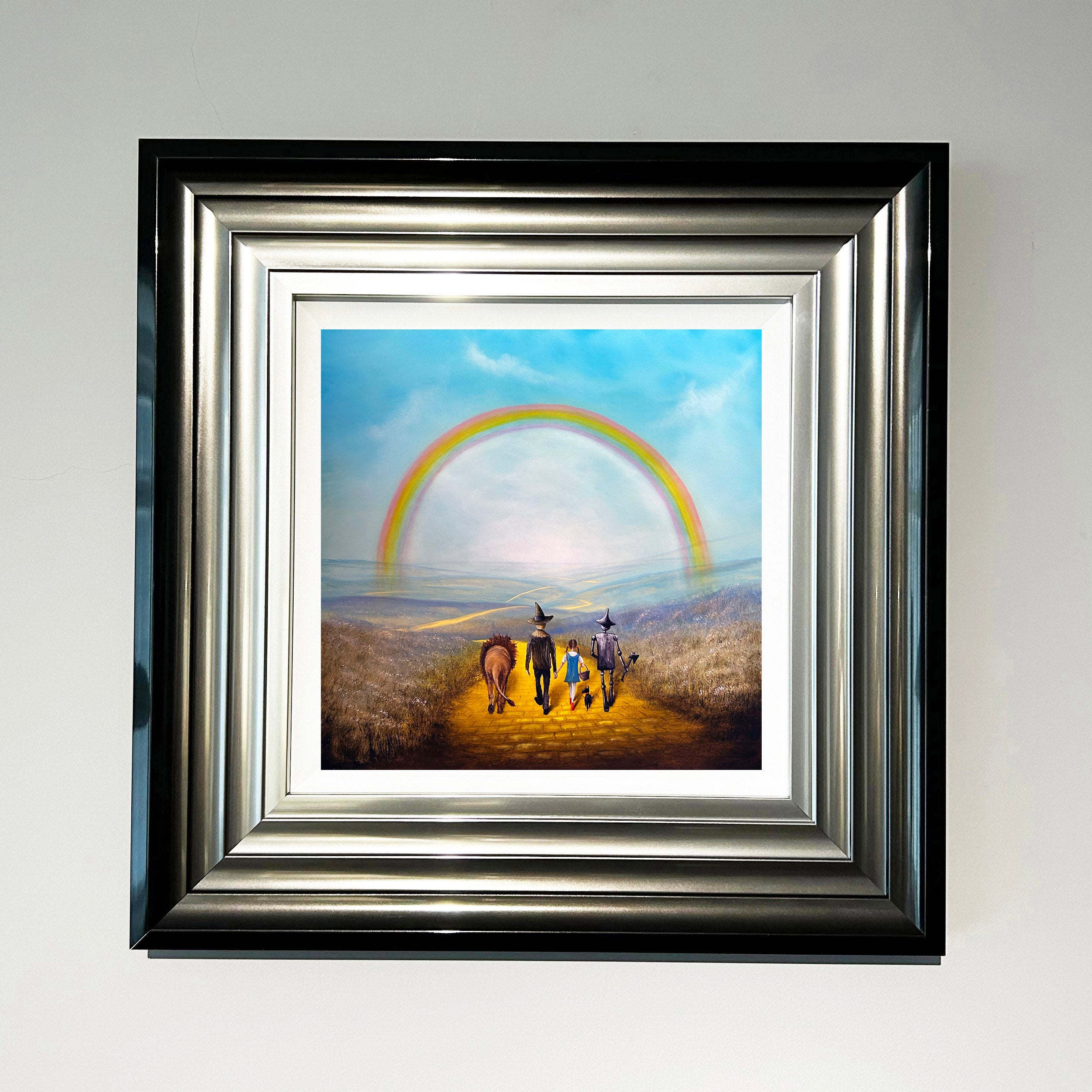 Wizard of Oz inspired painting of Dorothy, Toto, Scarecrow, Tin Man and Lion walking the yellow brick road beneath a rainbow by Danny Abrahams Art