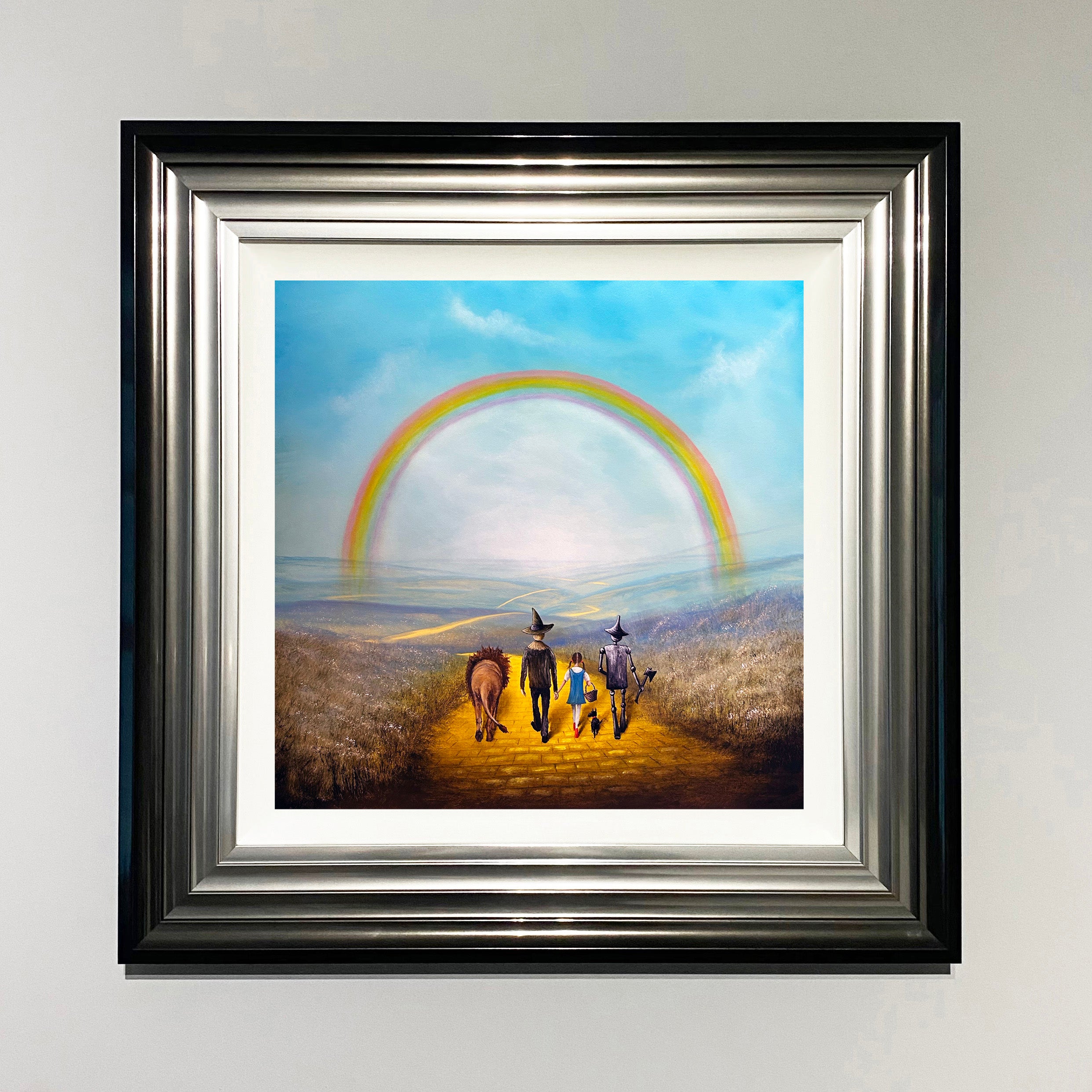 Wizard of Oz inspired painting of Dorothy, Toto, Scarecrow, Tin Man and Lion walking the yellow brick road beneath a rainbow by Danny Abrahams Art