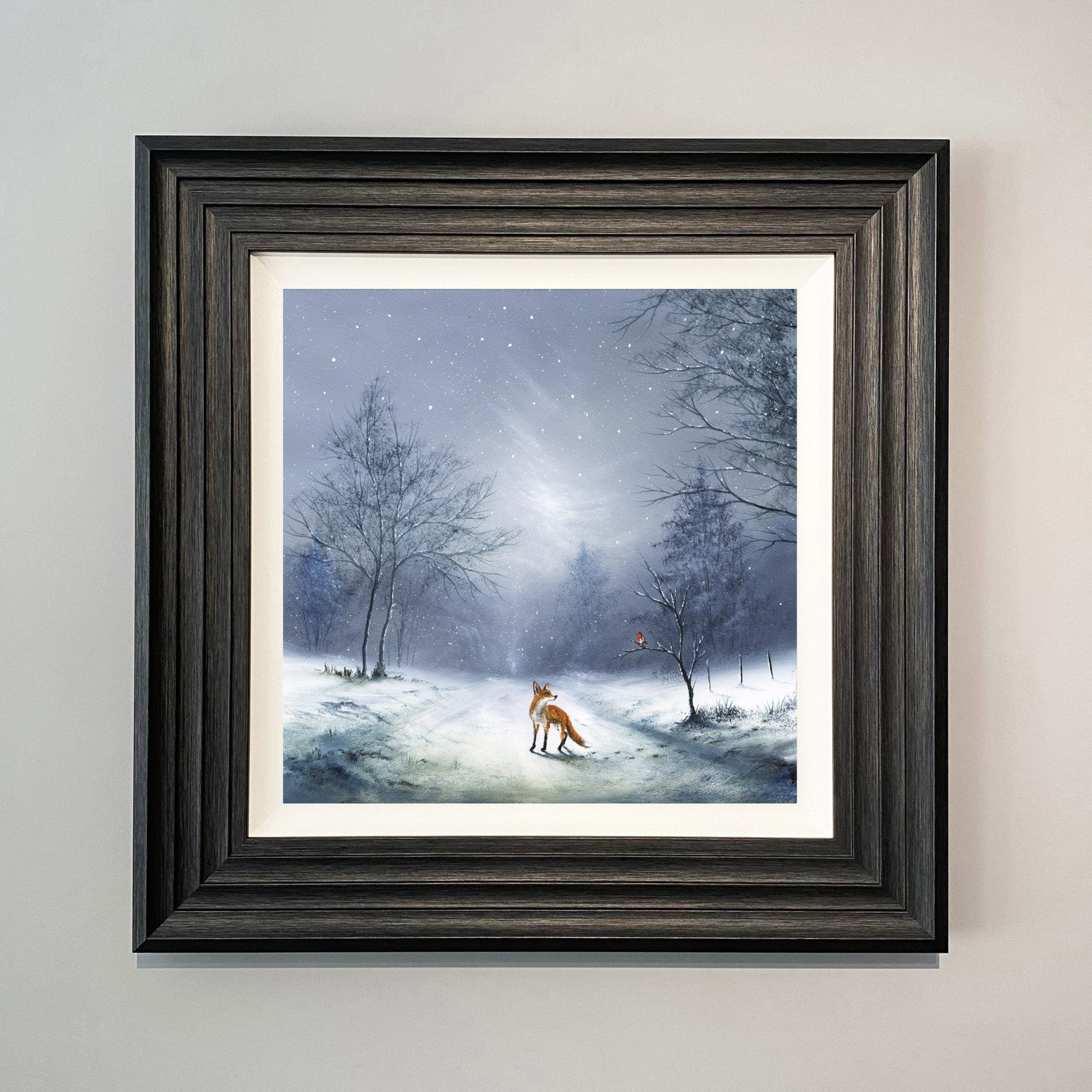 Friendship Warms The Heart landscape art print of a fox walking in the snow and a robin perched in a tree by Danny Abrahams
