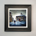 Silently The Snowflakes Fall winter landscape art print of Haworth Main Street Yorkshire withcouple walking in the snow by Danny Abrahams 