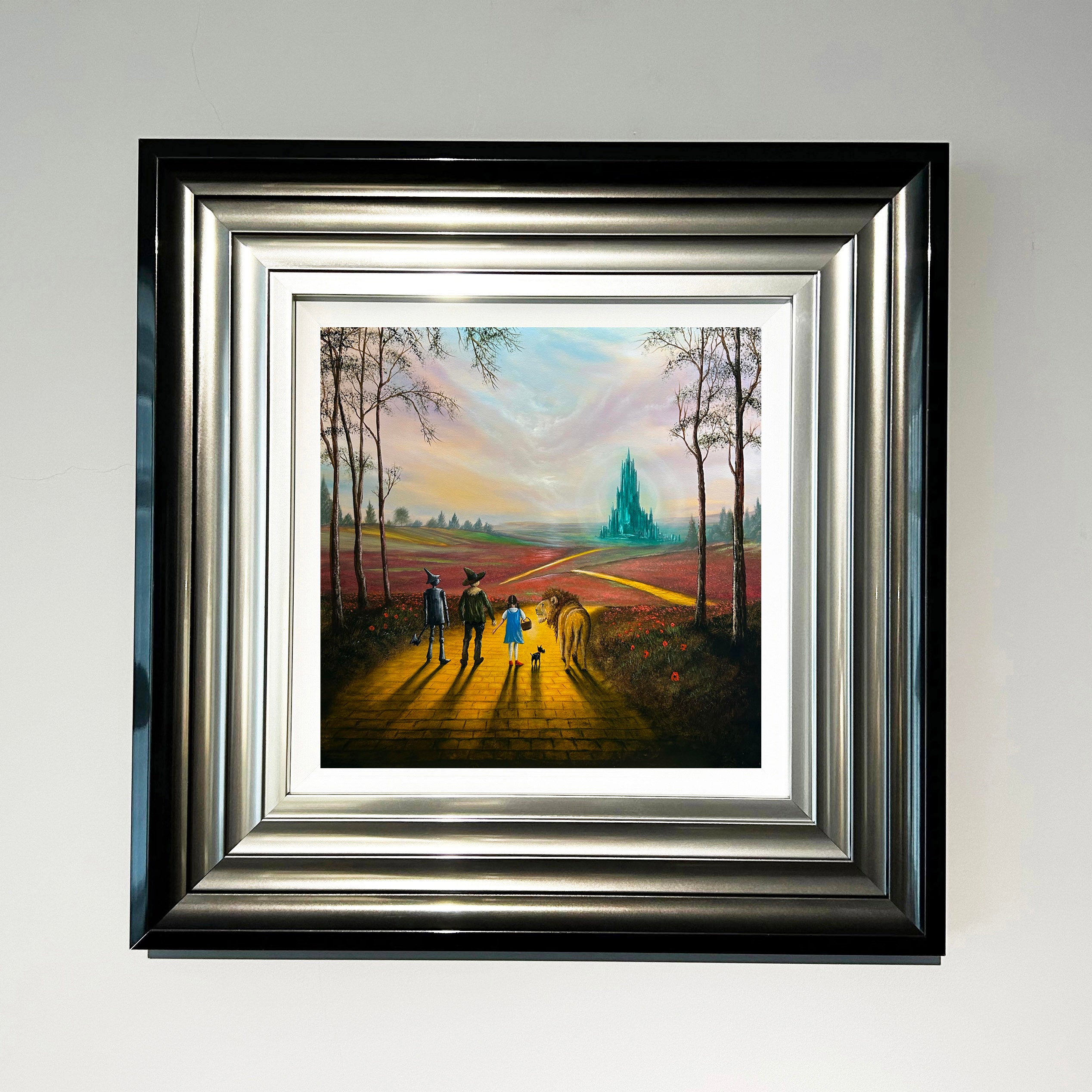 Wizard of Oz inspired yellow brick road painting with Dorothy, Scarecrow, Tin Man and Lion walking towards Emerald City by Danny Abrahams Art 